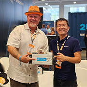 TheCoinDad with Zuoxing Yang, CEO of MicroBT holding a signed Whatsminer M1